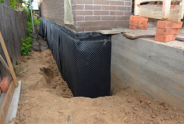 Happy homeowners after waterproofing job in Galion